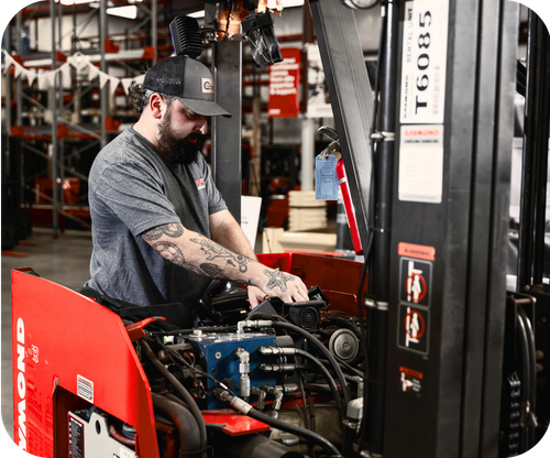 Tech working on forklift